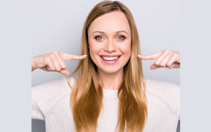 Decorative - Woman pointing at her teeth